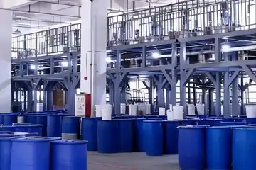 Clean and organized production workshop at StarColor factory featuring stainless steel mixing tanks and modern flexo ink manufacturing equipment.